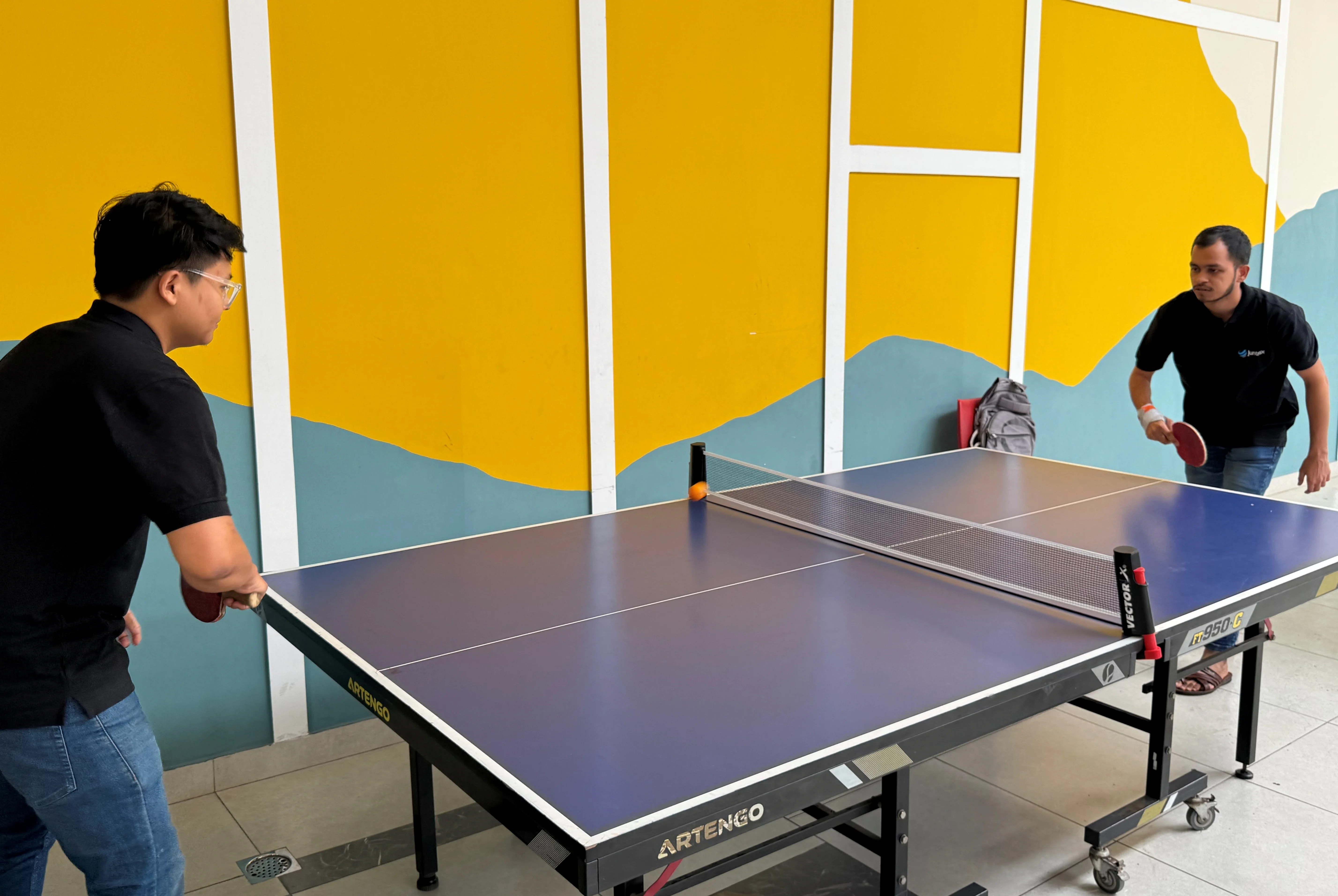 Juntrax team playing table tennis